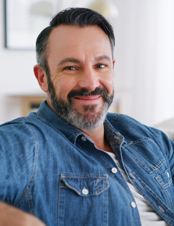 Portrait of a smiling man representing compassionate spiritual guidance, emotional healing, and personal transformation at Abagael Spiritual.